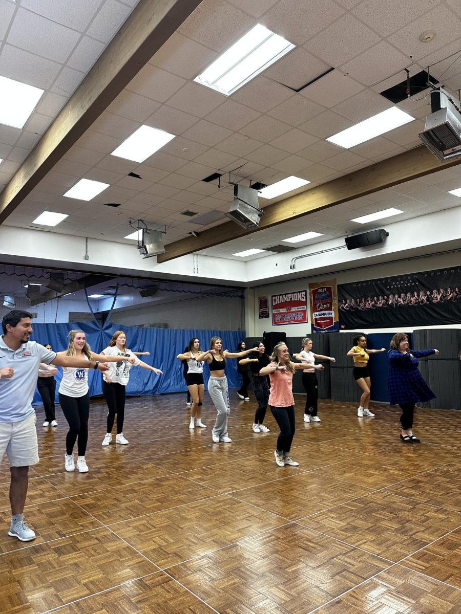 WHS teachers practice their moves with WHS dance team. 