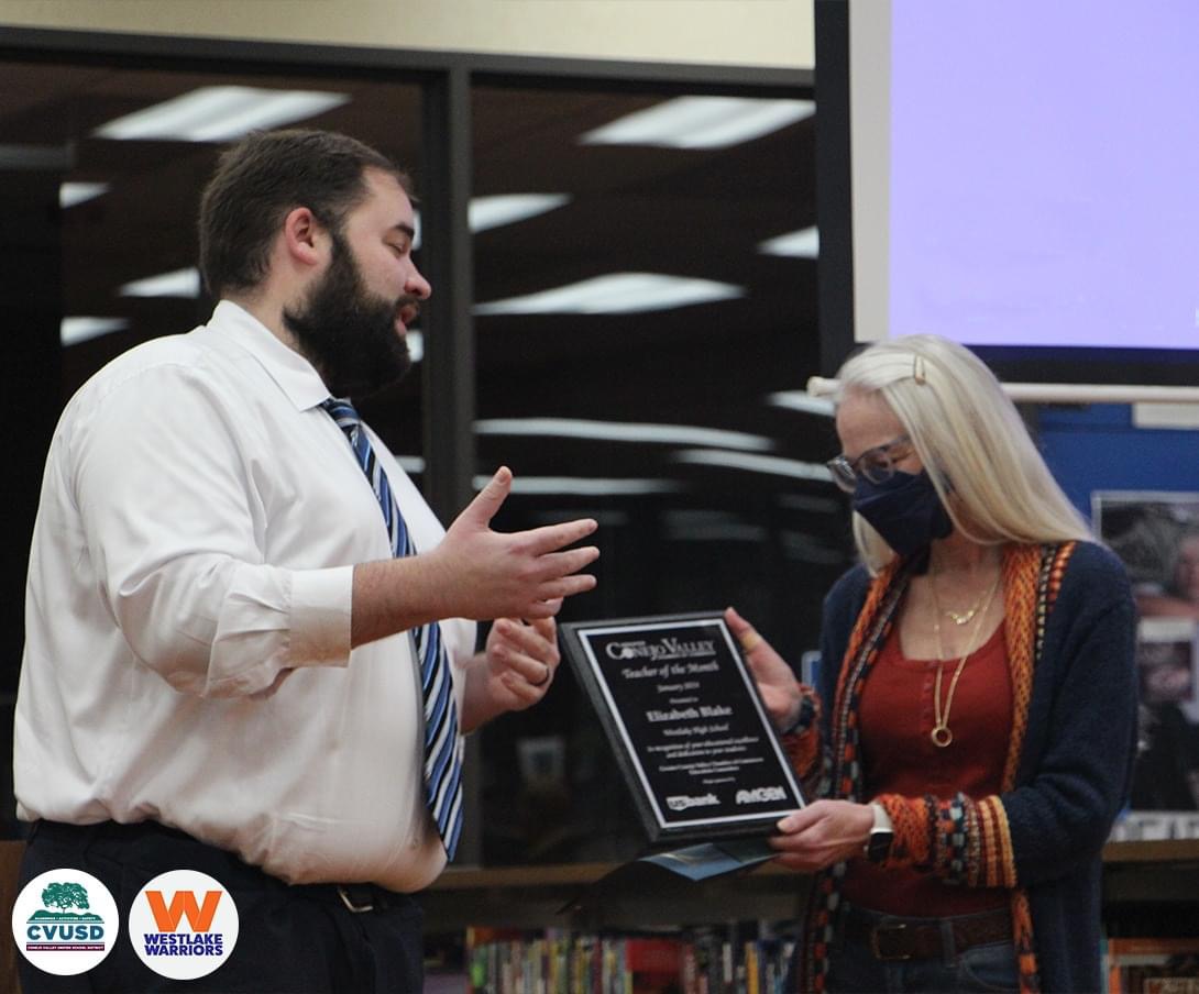 Liz Blake is presented with the Teacher of the Month Award. 