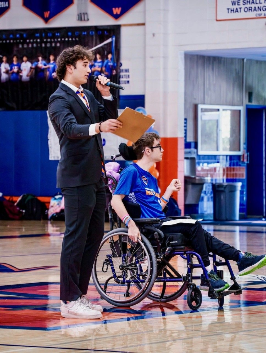 Asher Cohen '27 and Ethan Karkoon '26 kick off the Unified Sports Basketball game against Newbury Park High School with a welcome speech addressed to the student body.