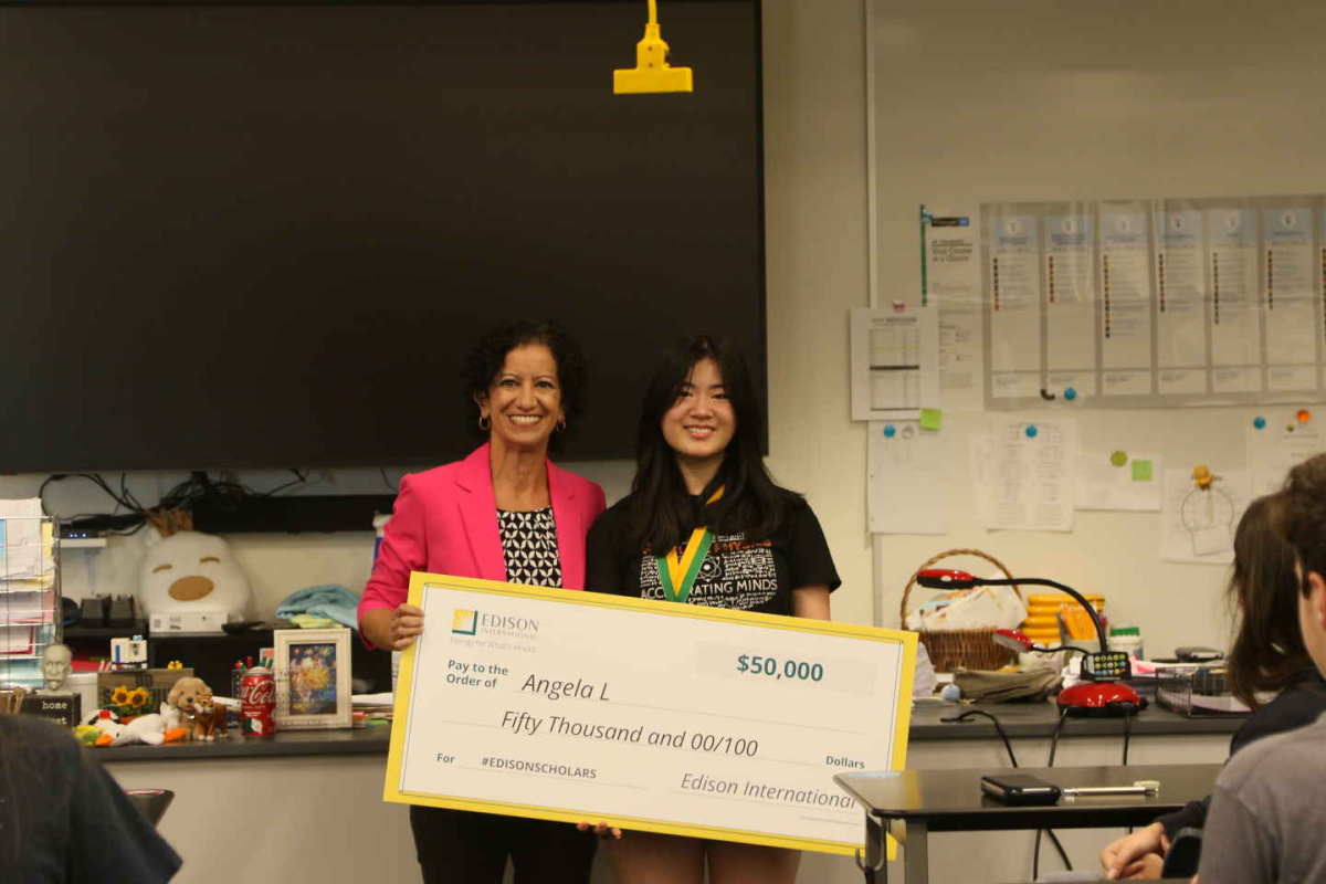STRIVING FOR SUCCESS: Angela Liu ‘26 proudly holds her scholarship check with Christy Fanous, Southern California Edison Vice President of customer experience and performance. Liu was surprised during her class with the award and kind messages from staff members. “I was so surprised when the Edison Company representatives showed up in my 4th period AP Chemistry class to give me the award,” said Liu. “I couldn’t stop smiling.”
